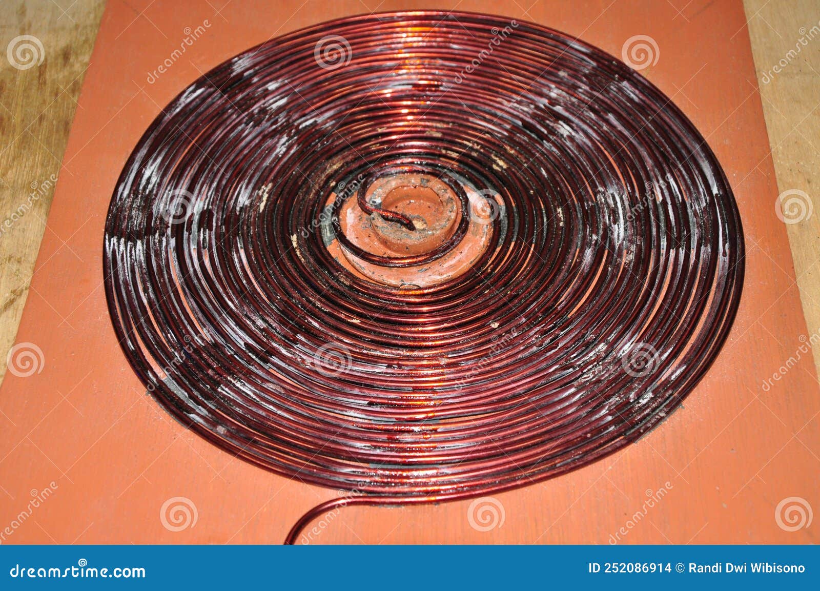 Unshielded Copper Wire is Coiled in a Spiral To Form a Disc Stock Photo
