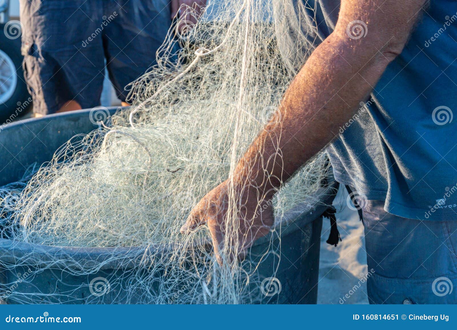 Mending a fishing net stock image. Image of fishermen - 160814651