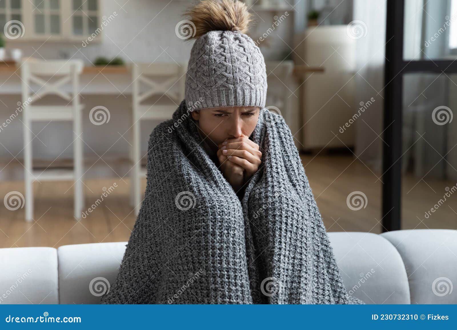unwell woman feel cold in home with no heating