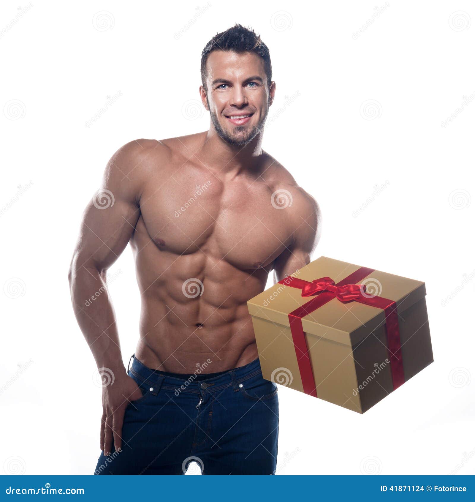 Uomo Sexy Muscolare Con Un Regalo Fotografia Stock - Immagine di