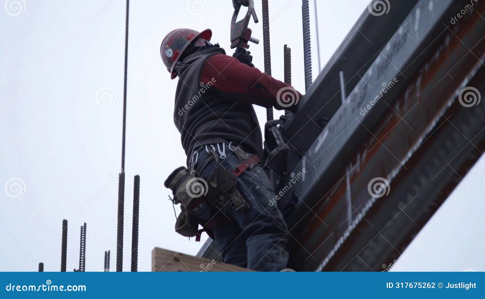 an upclose shot of a worker securing a steel beam into place adding to the structural integrity of the skyser core