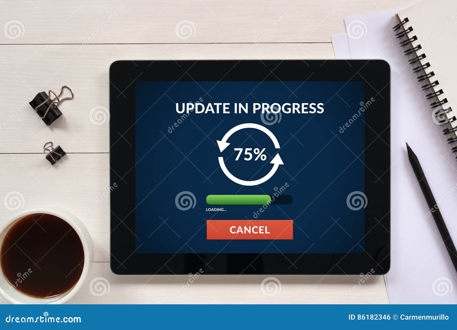 update concept on tablet screen with office objects on white woo