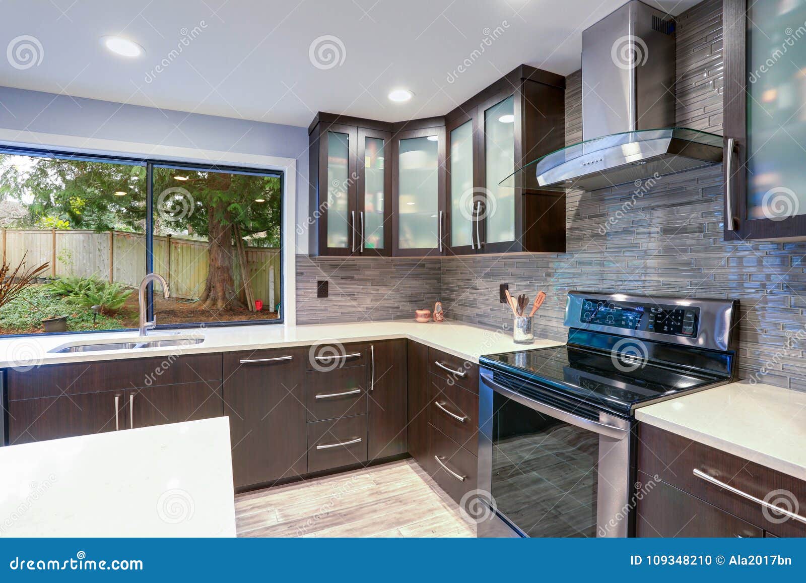 updated contemporary kitchen room interior in white and dark tones.