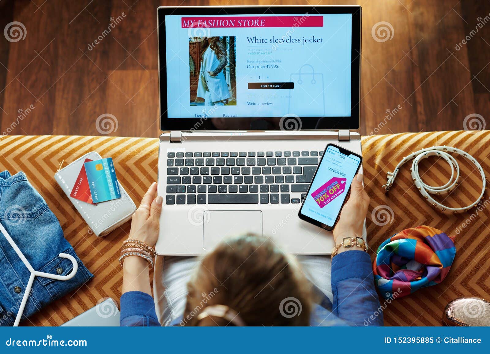 woman browsing high fashion retail online store on laptop