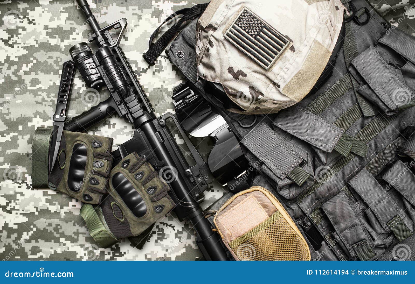 military tactical equipment with rifle.