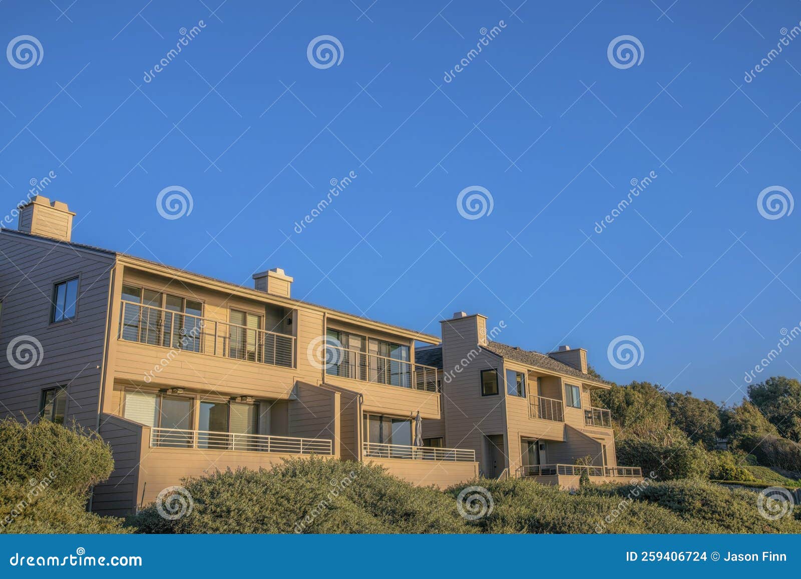 Upscale Houses with Balconies Against Blue Sky at Del Mar Southern