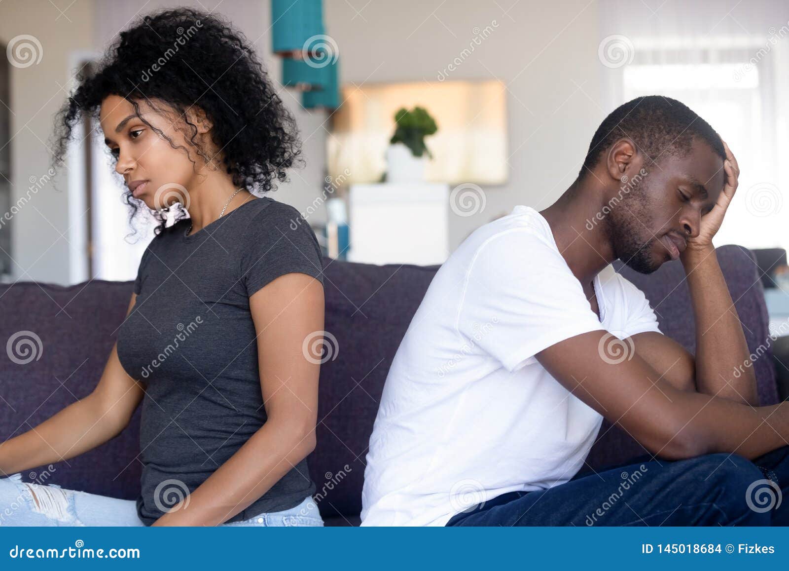 Upset African American Couple Ignore Each Other After
