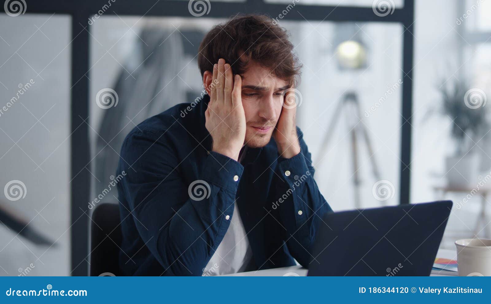 upset businessman finding mistakes in documents. frustrated man looking graphs