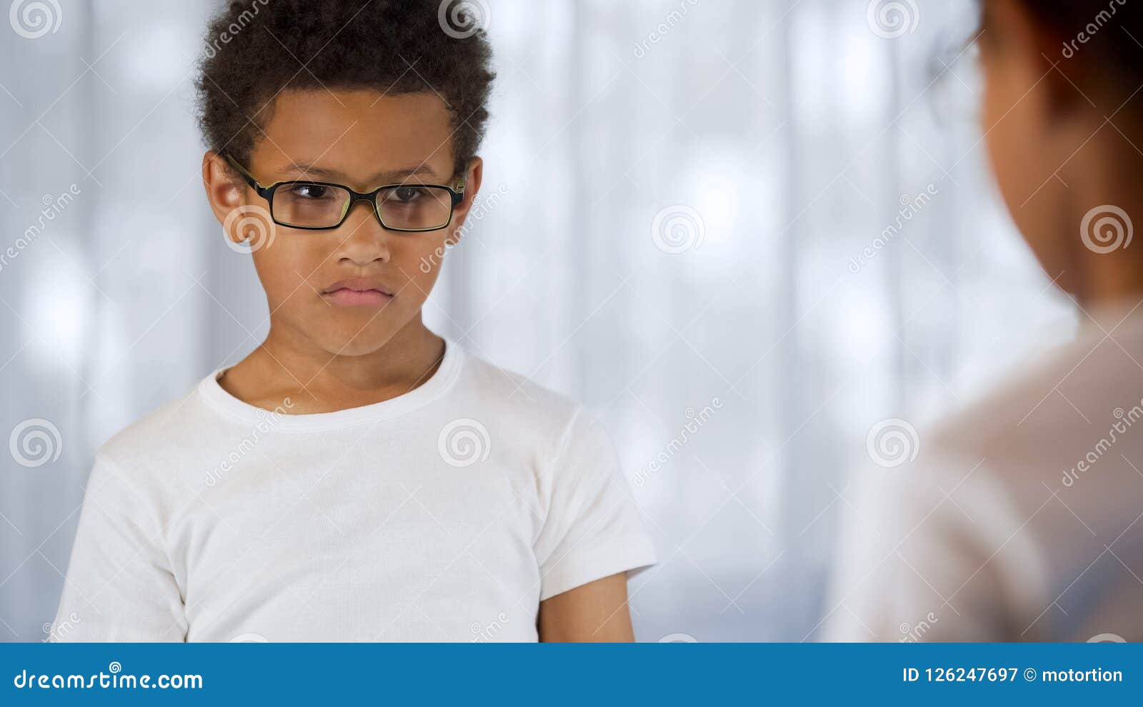upset child in eyeglasses looking mirror reflection, blurry vision, insecurities