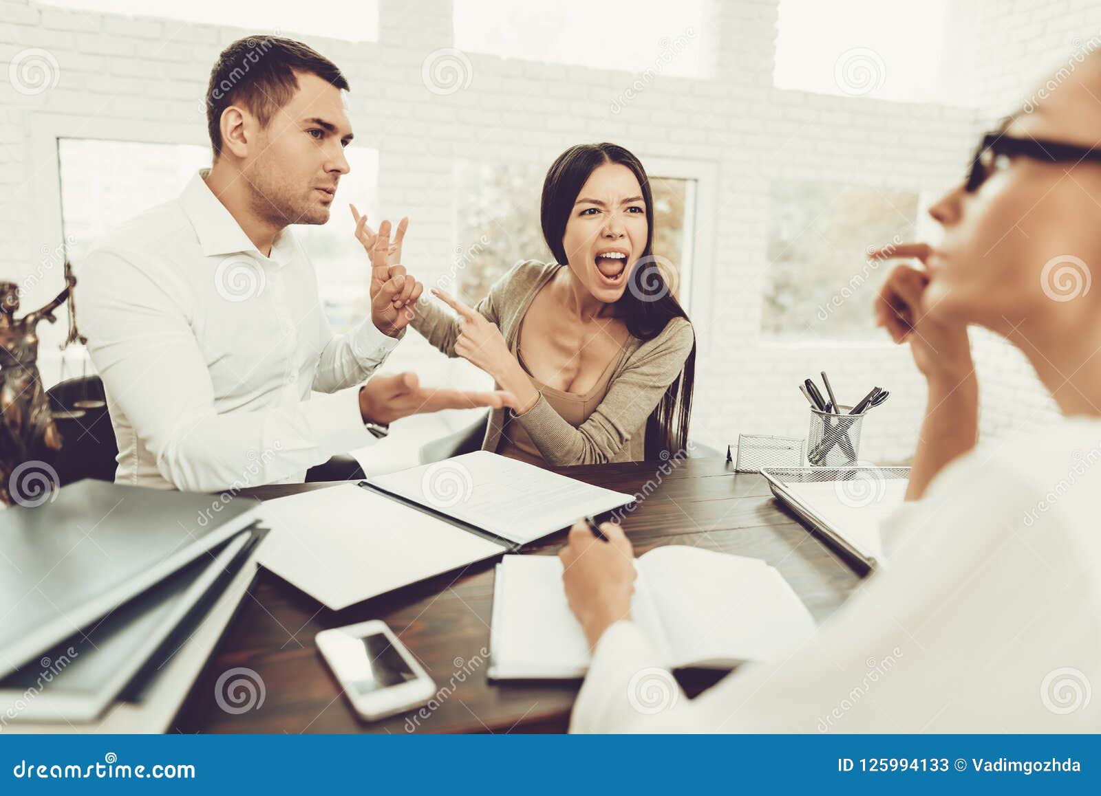 Upset Husband And Angry Wife In Office With Lawyer Stock Image Image