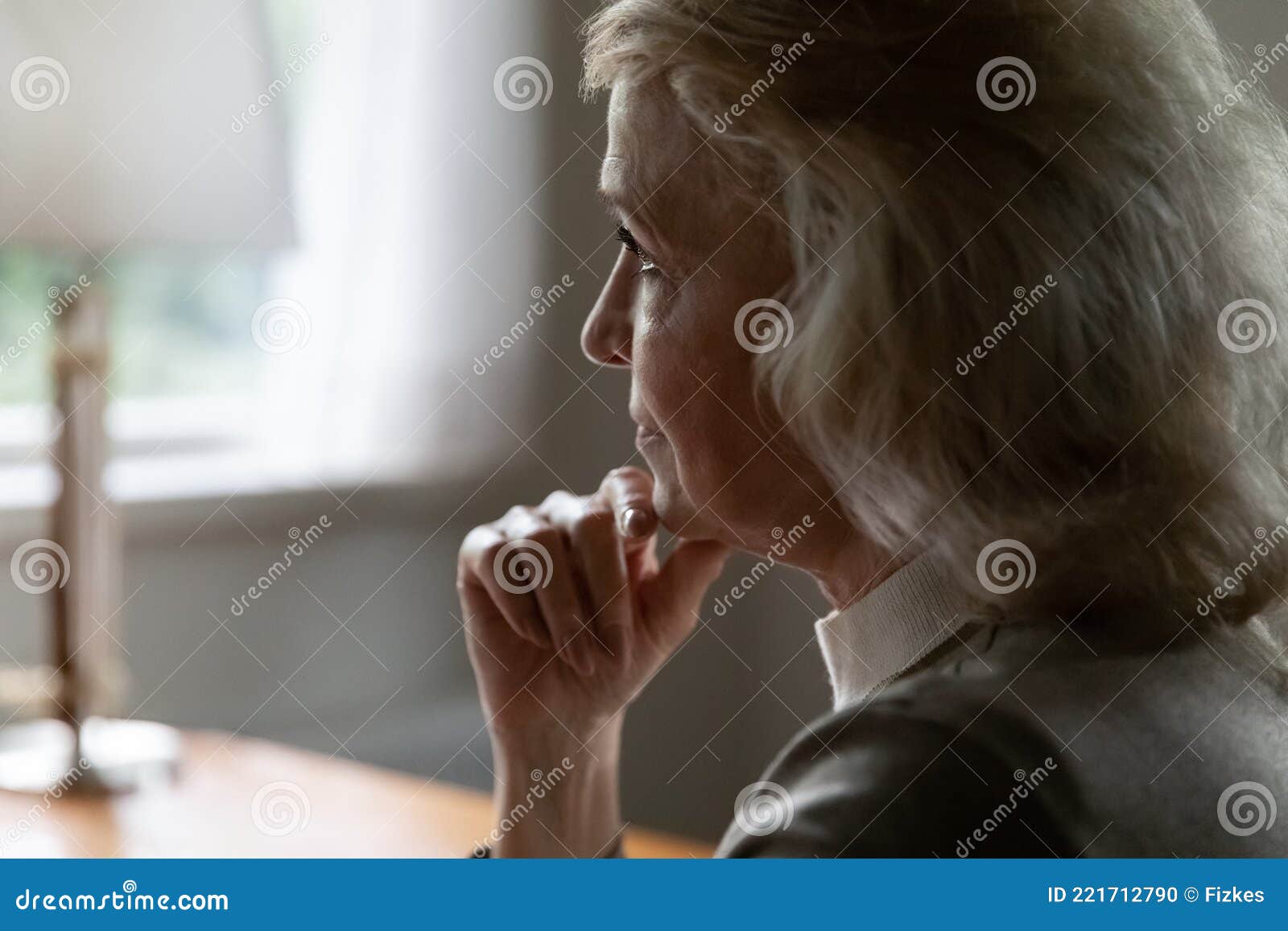 upset mature female look in distance thinking of maturity