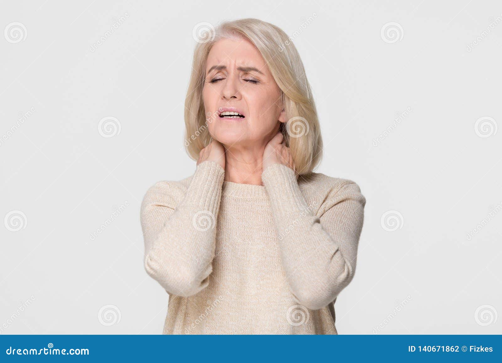 upset mature woman massage feeling neck pain  on background