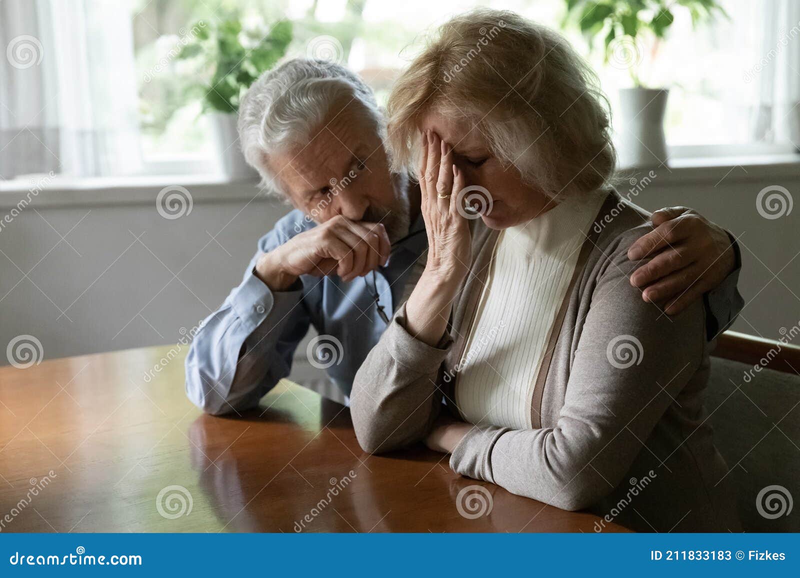 upset middle aged family couple getting bad news