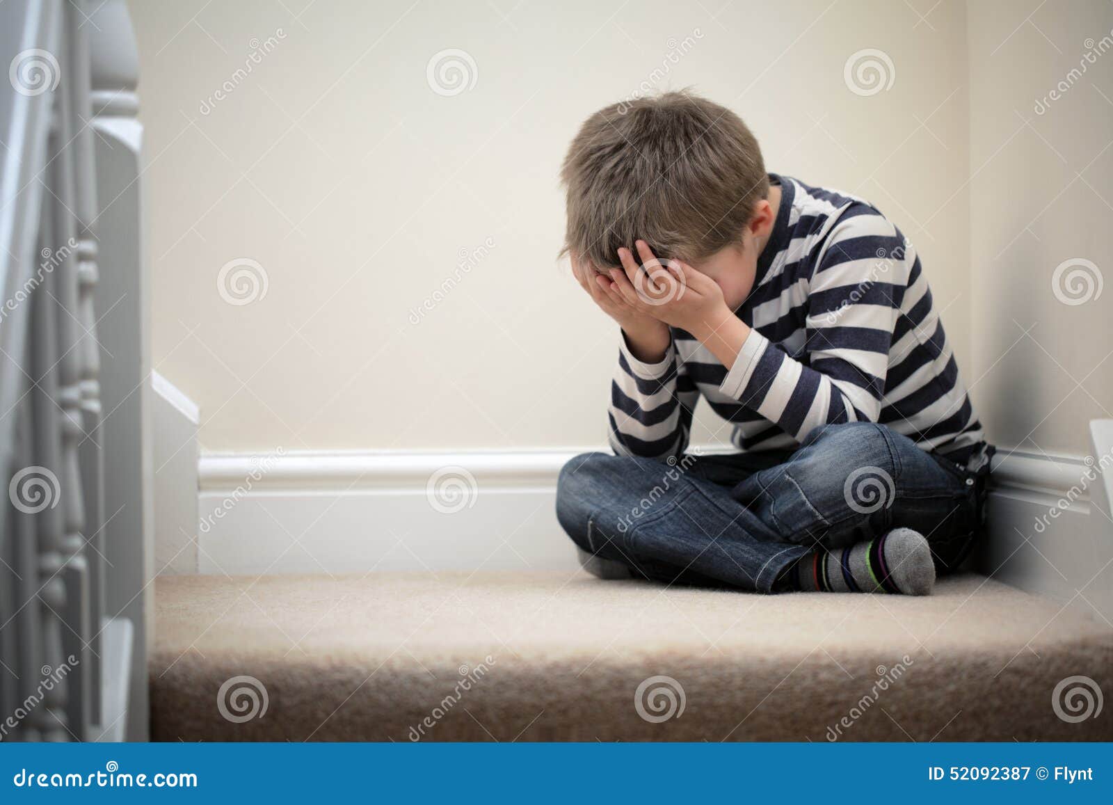upset problem child sitting on staircase