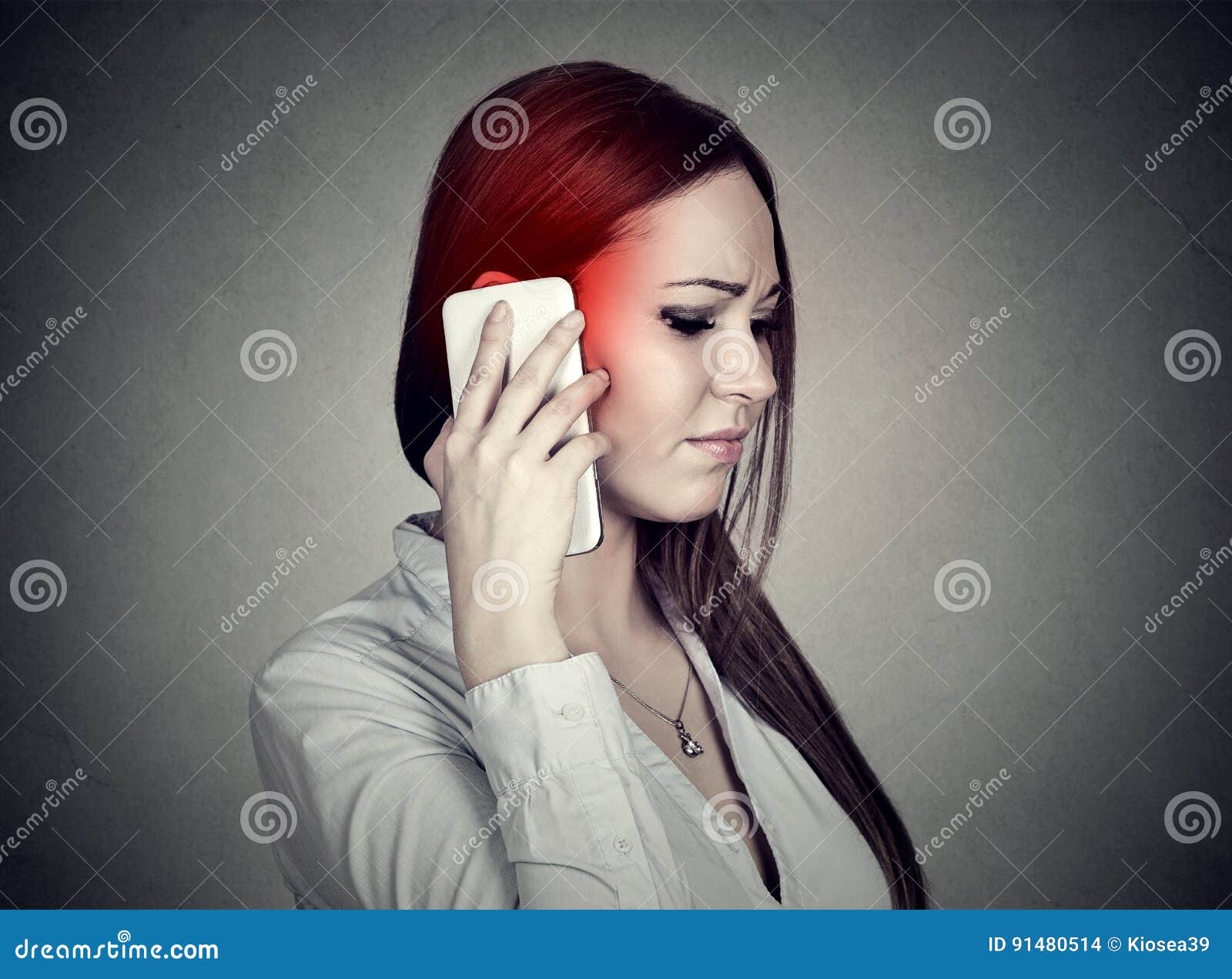 upset sad woman talking on mobile phone. cellular mobile radiation concept