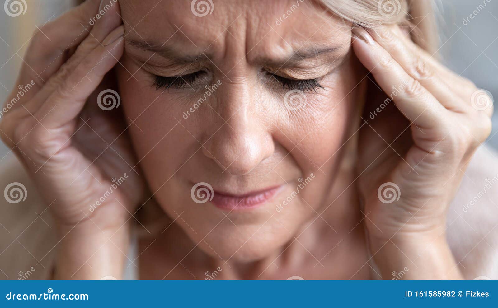 upset stressed old woman feel terrible migraine, close up view