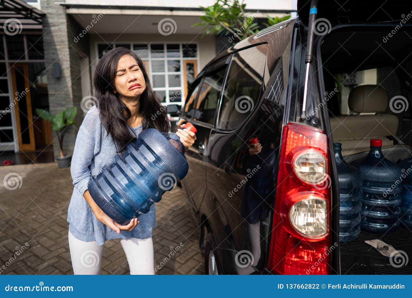 Upset Woman Try To Carry Gallon of Water Stock Photo Image of health