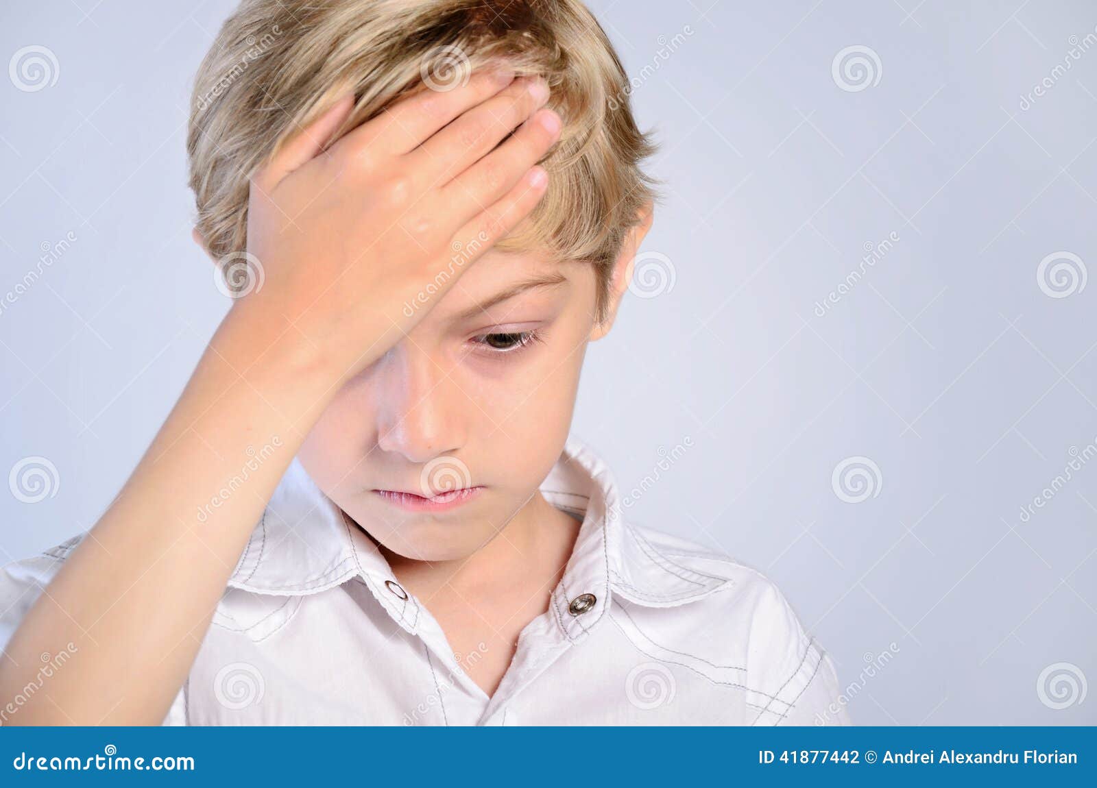Upset young boy stock photo. Image of headache, child 41877442