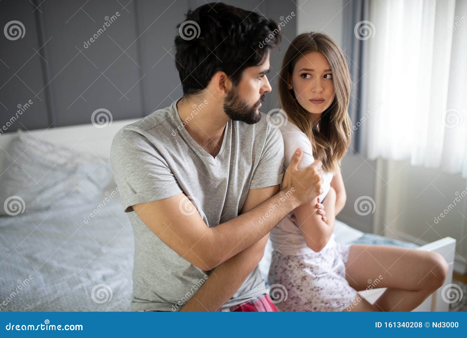 Upset Young Couple Having Problems with