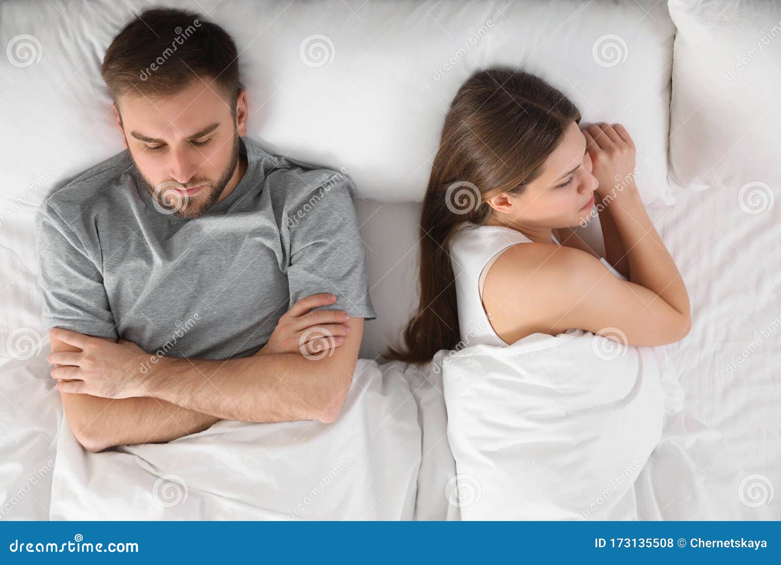 Upset Young Woman Near Sleeping Husband in Bed. Relationship Problems ...