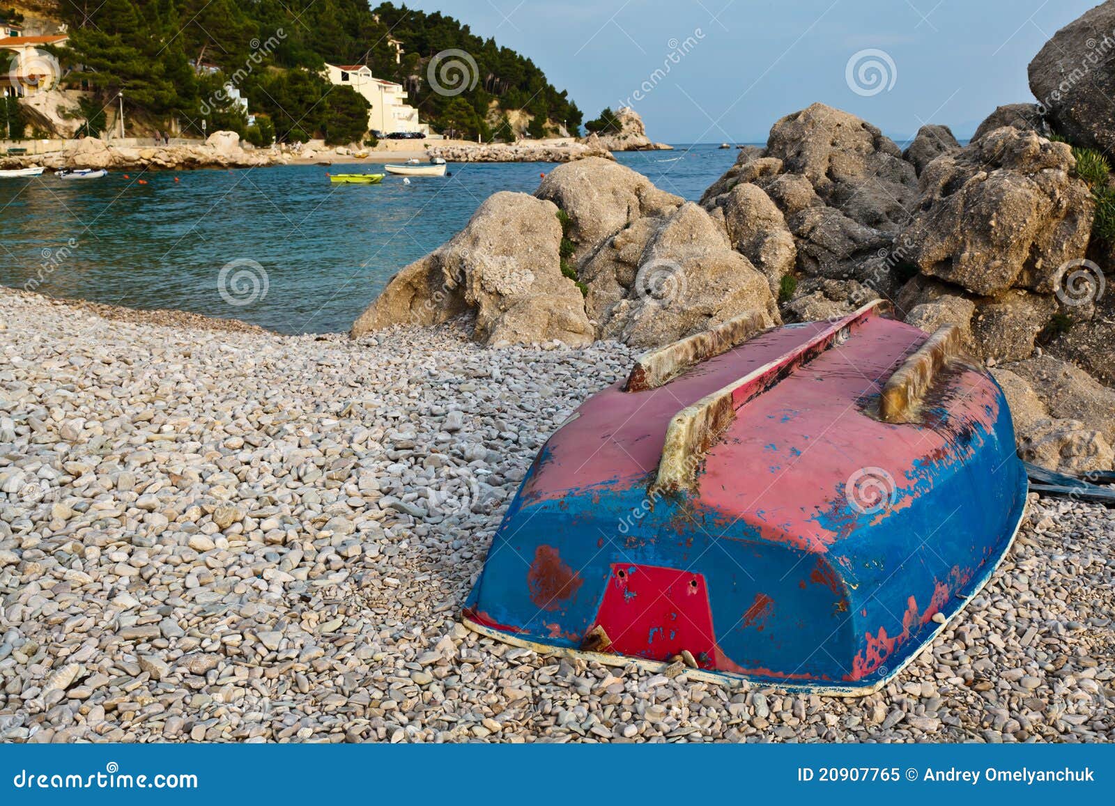 SMALL WOODEN FISHING BOATS LYING UPSIDE DOWN ON SHORE. CHINESE