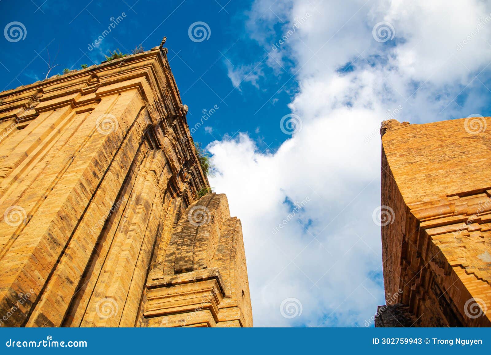 upward view of north tower or thap chinh and central tower or thap nam of ponagar cham towers with terraced pyramidal roof, built