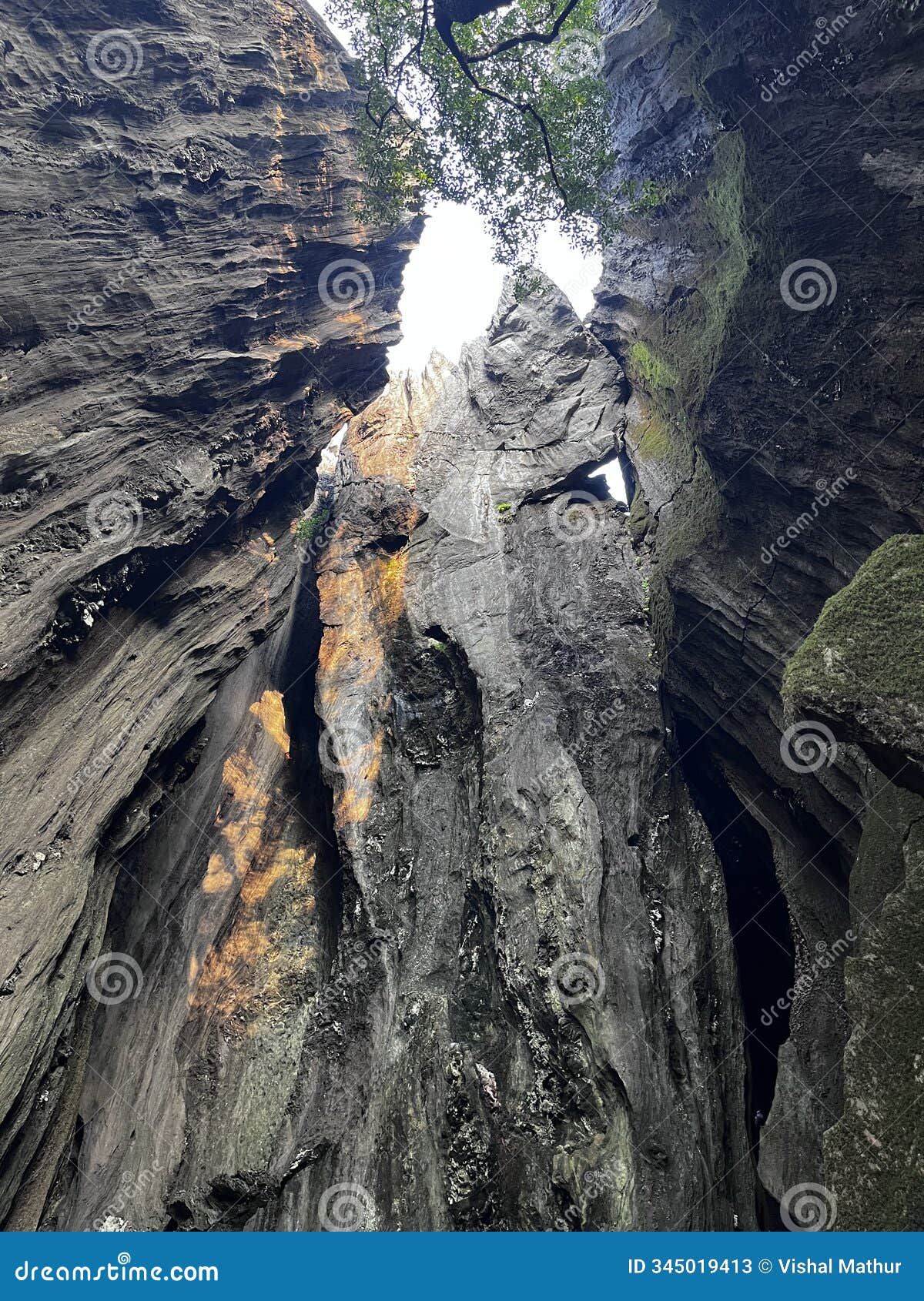an upward view into the sky from inside the yana caves in karnataka.