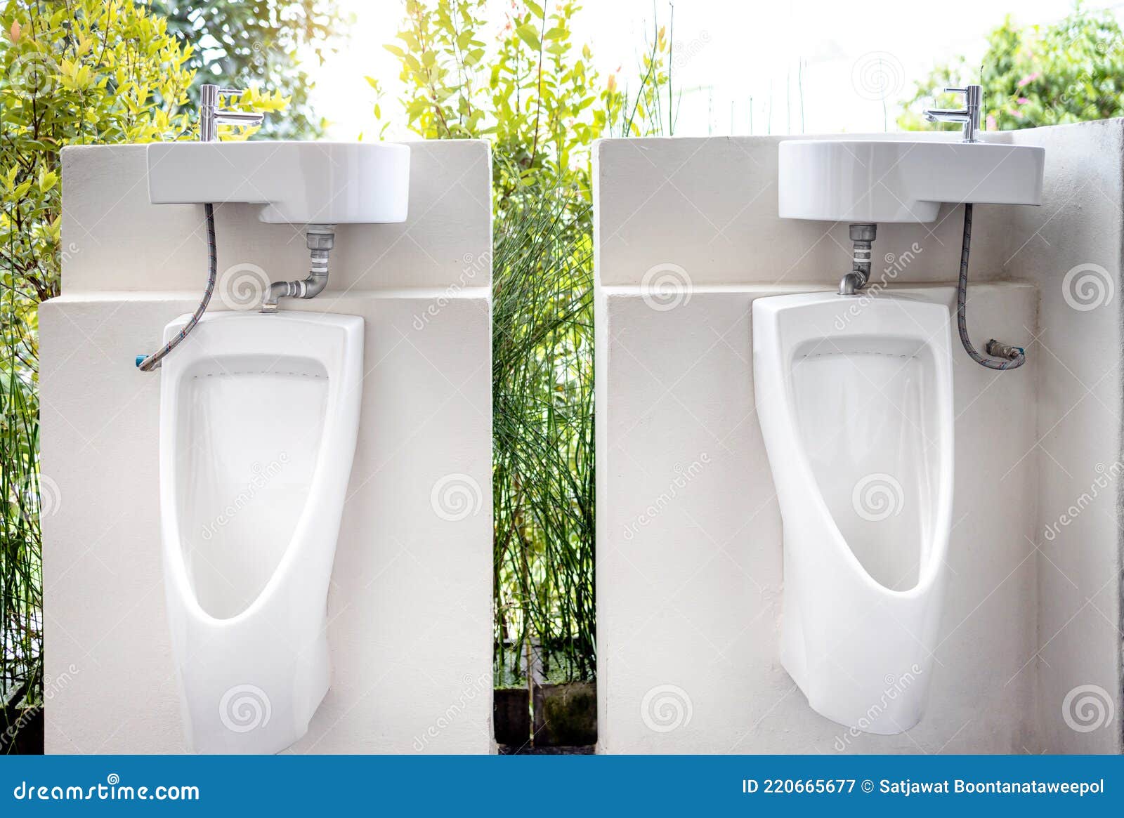 urinals for men to urinate and hand washing point in the male toilet at park,white urinal with a sink on top of the urinal to