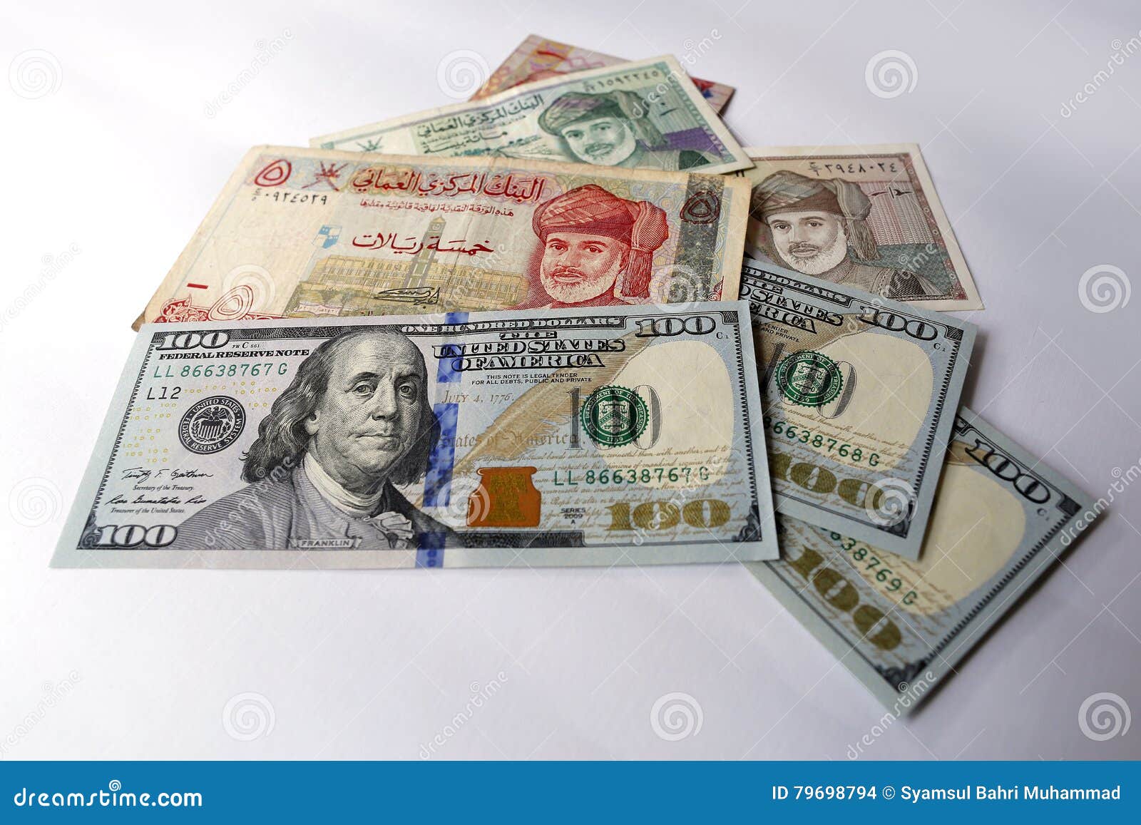 Us Dollar And Omani Riyal On White Background Stock Photo Image