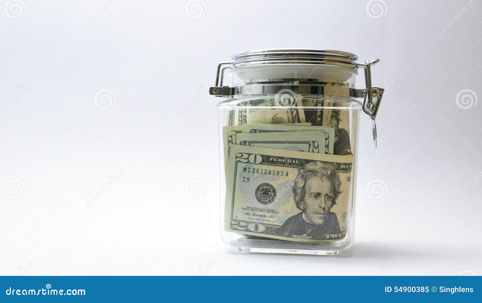 US Money or Currency or Dollars in Glass Jar Stock Image Image of