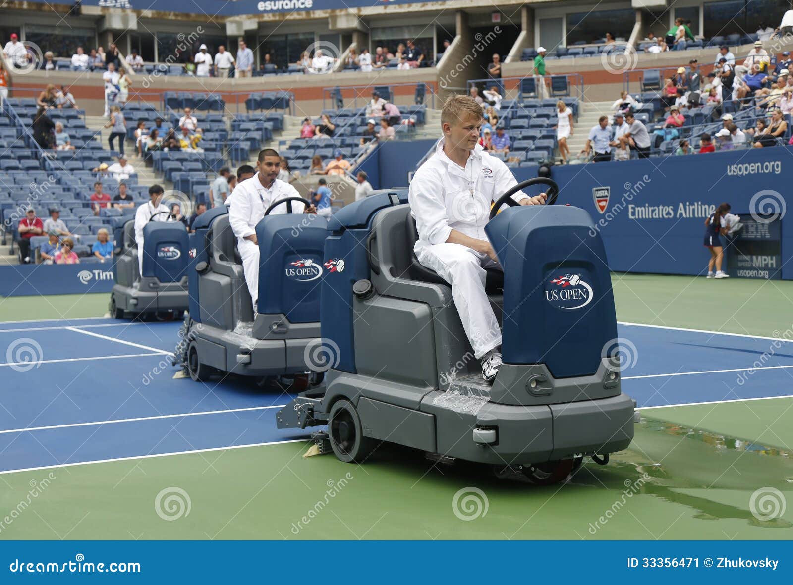 US Open Cleaning Crew Drying Tennis Court after Rain Delay at Arthur Ashe Stadium Editorial Photo