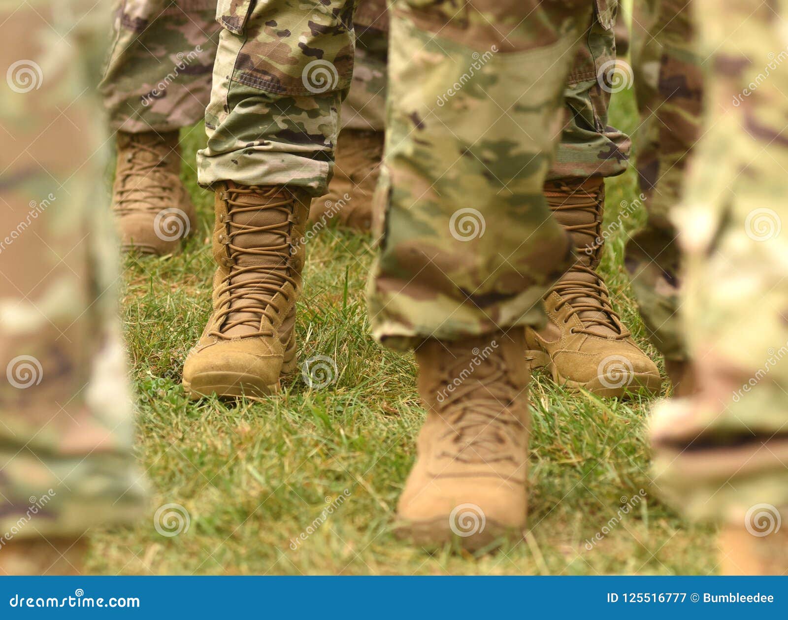 us soldiers legs in green camouflage military uniform. us troops