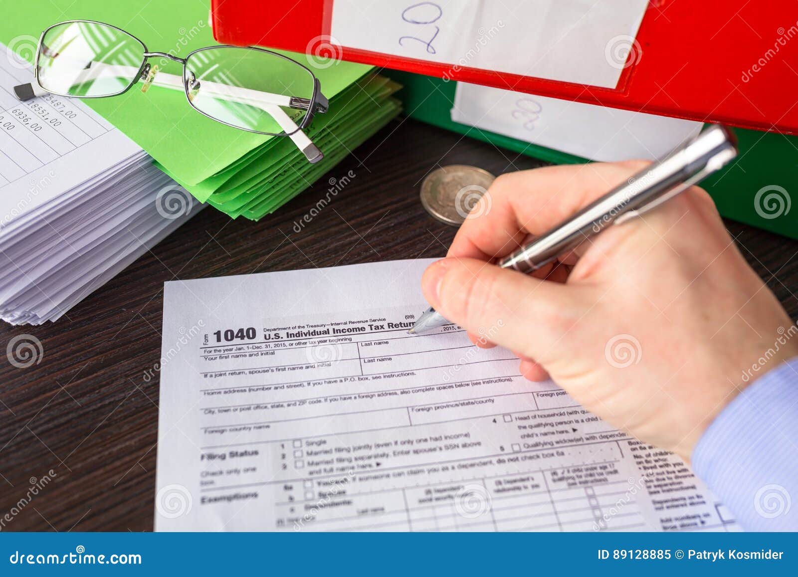 1040 Individual Income Tax Return Blank And Pen On Calendar Page With 1040-individual-income-tax-return-blank-and-pen-on-calendar-page-with