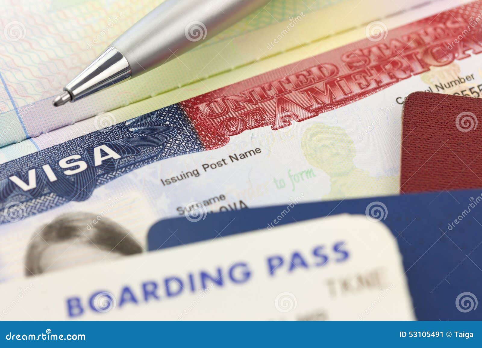 usa visa, passports, boarding pass and pen - foreign travel