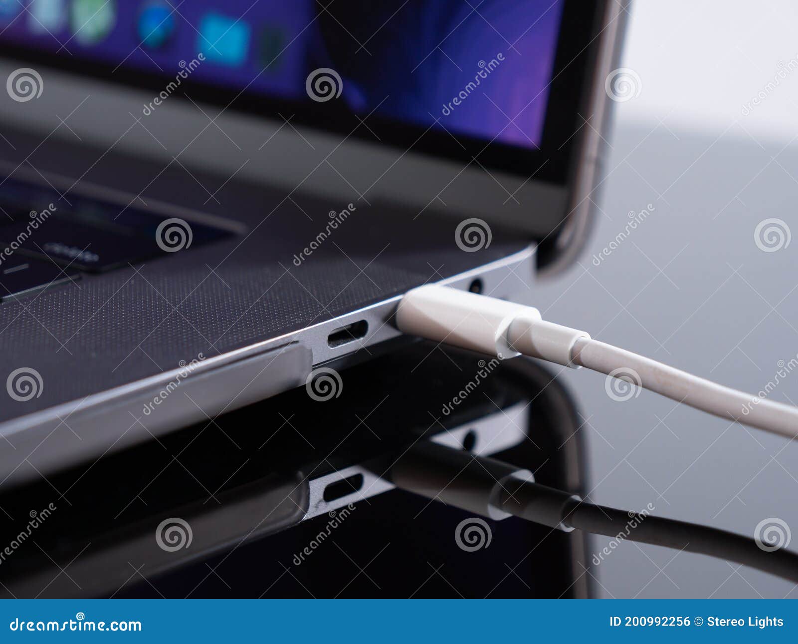 USB Type C Cable Being Connected To the Laptop Computer. Fast Charging