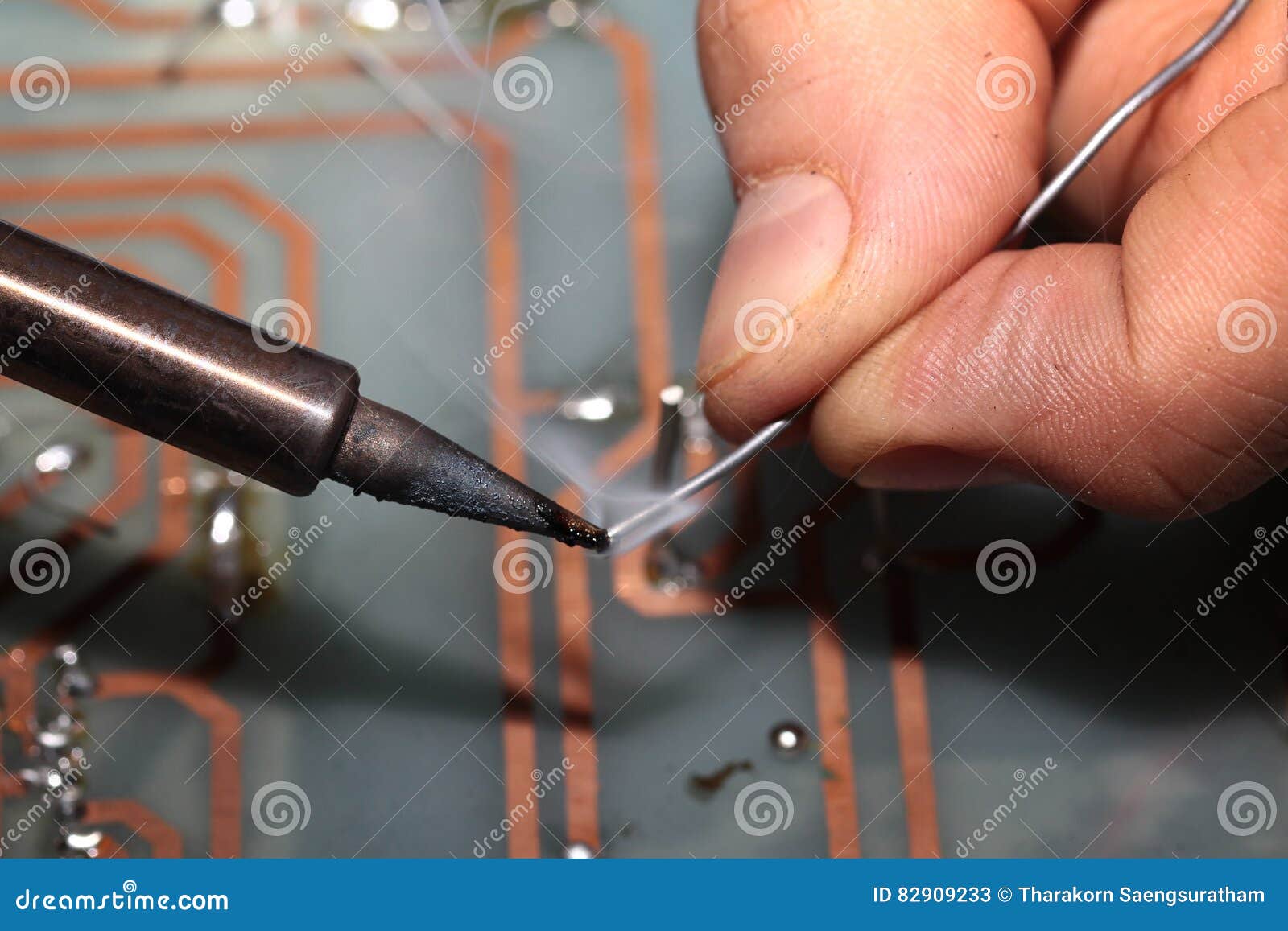 Use Soldering Iron To Weld Connection Pore with Tin Wire. Stock Image