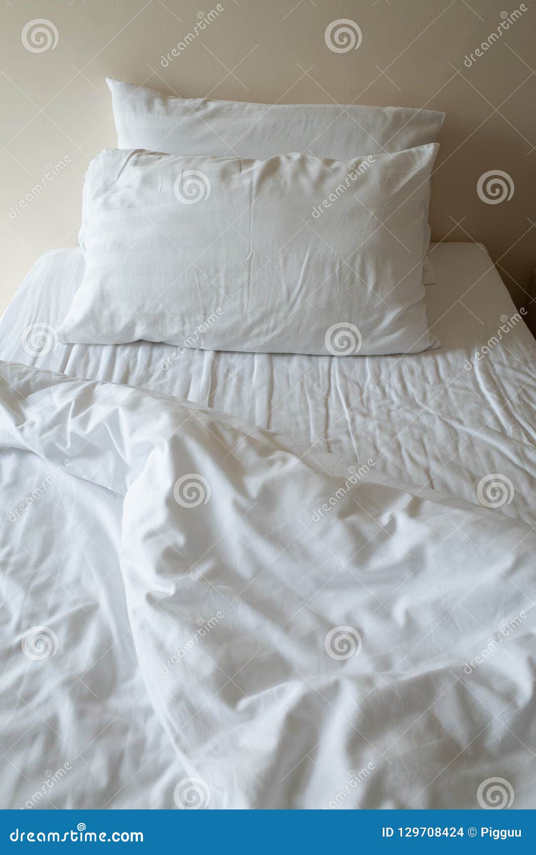 White Crumpled Pillows On Hotel Bed Stock Photo - Image of ...