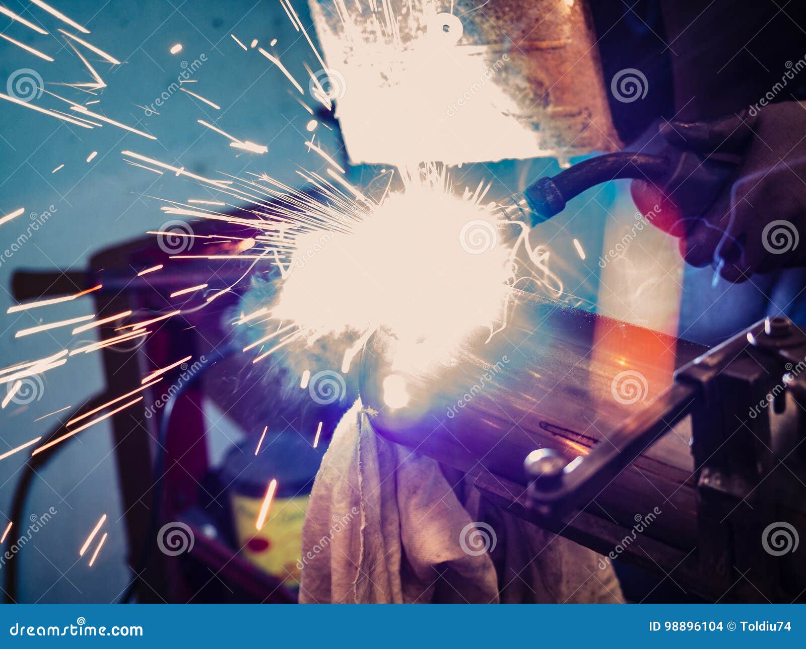 Use of Wire Welding Machine in a Stock Photo Image of fire