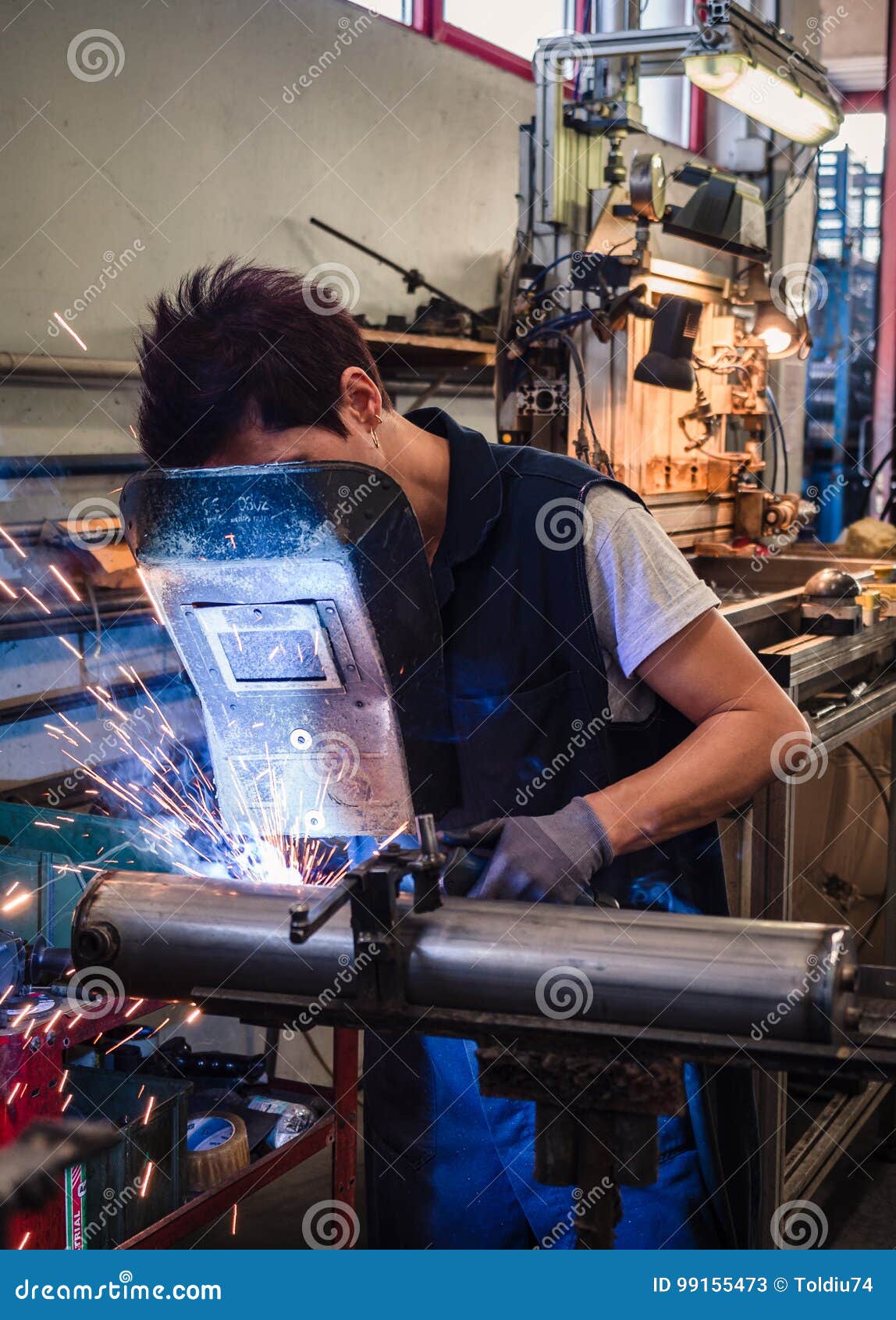 Use of Wire Welding Machine in a Editorial Stock Photo