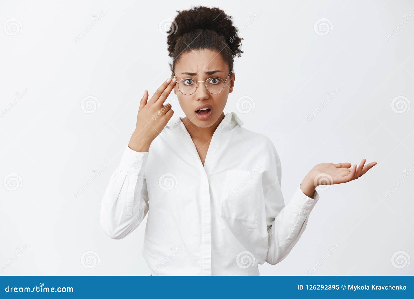 use your brain, stupid. annoyed and displeased good-looking african-american entrepreneur in glasses and white shirt