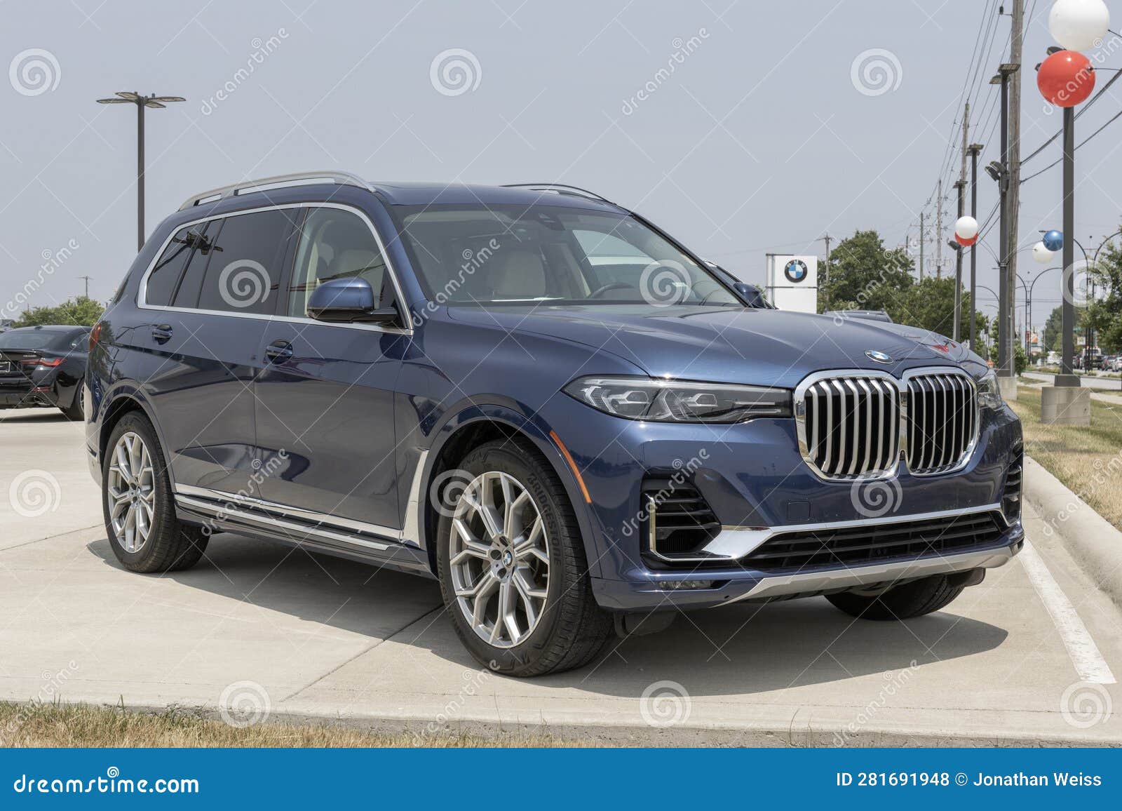 used bmw x7 xdrive40i on display at a dealership. with supply issues, bmw is buying and selling preowned cars to meet demand