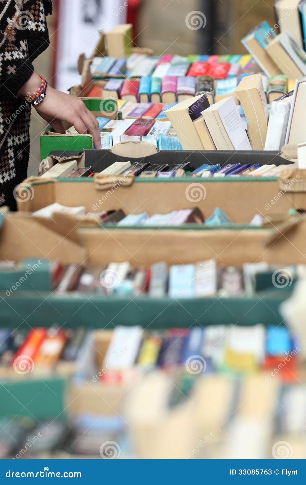 Used book sale. Looking through old books in a second hand book sale