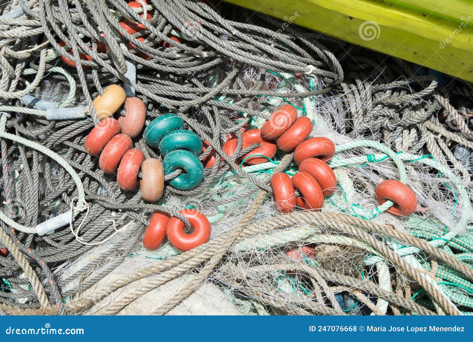 Used Fishing Net with Colorful Pvc Floats Out of Water for Repair