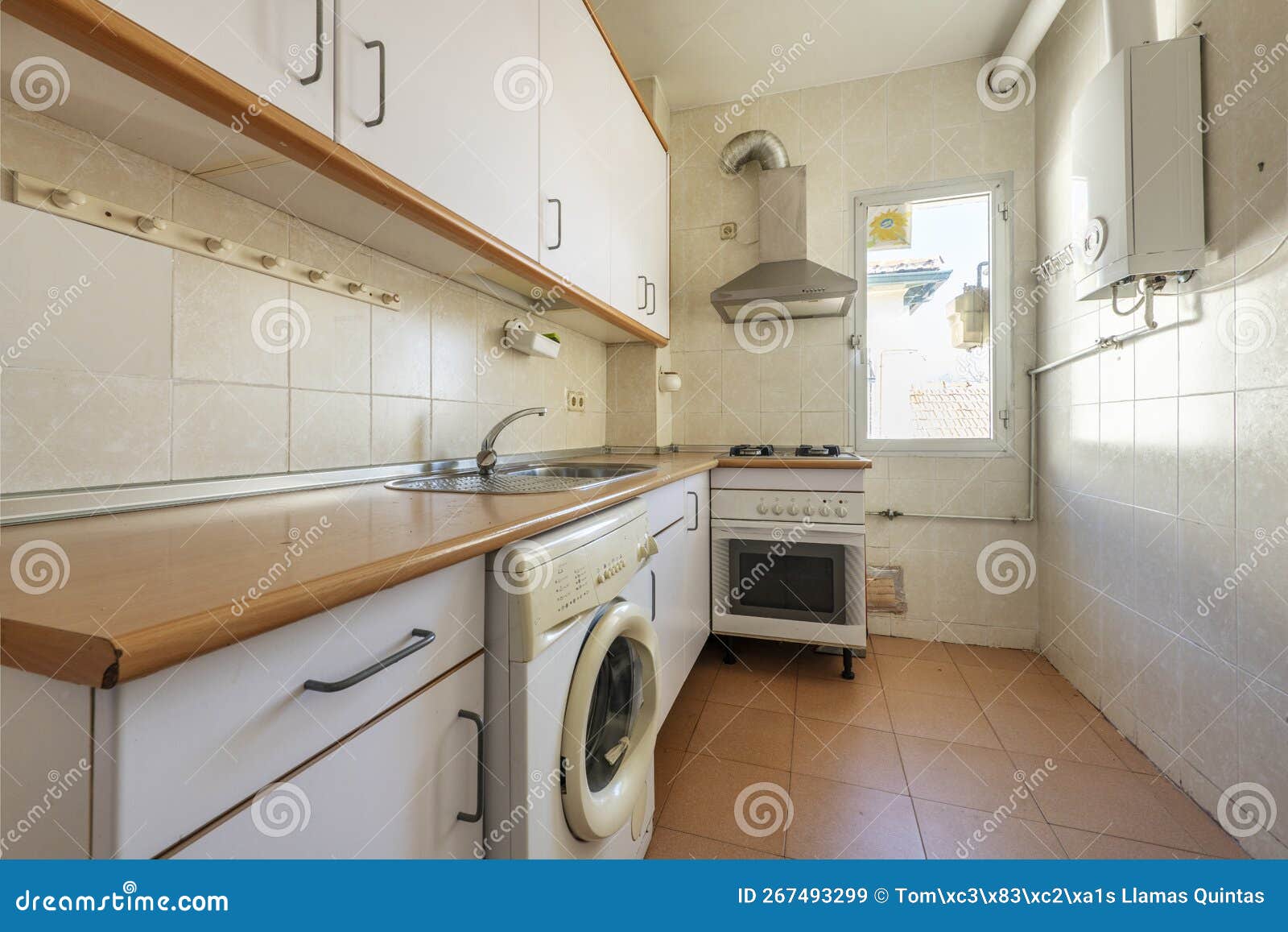 used kitchen from a cheap apartment with natural gas boiler and gas cooker