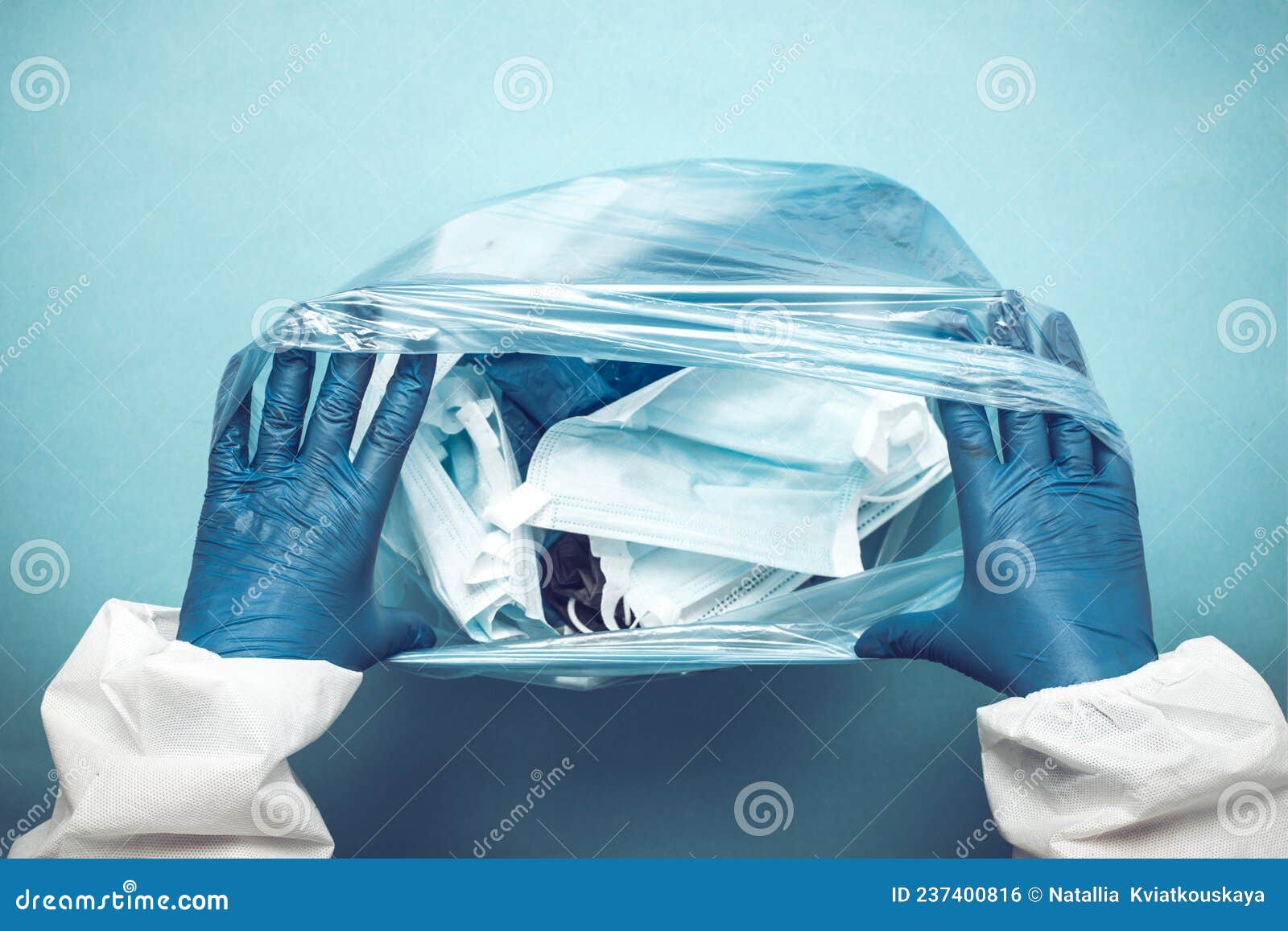 Used Medical Masks in a Plastic Bag. Blue Face Masks after Use Stock