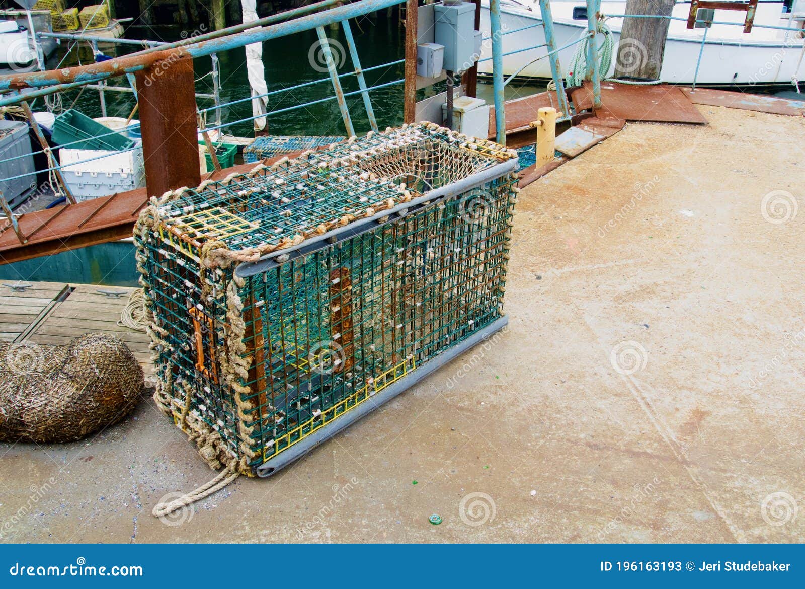 Real Wire Lobster Trap in Situ on Dock of a Wharf Stock Image