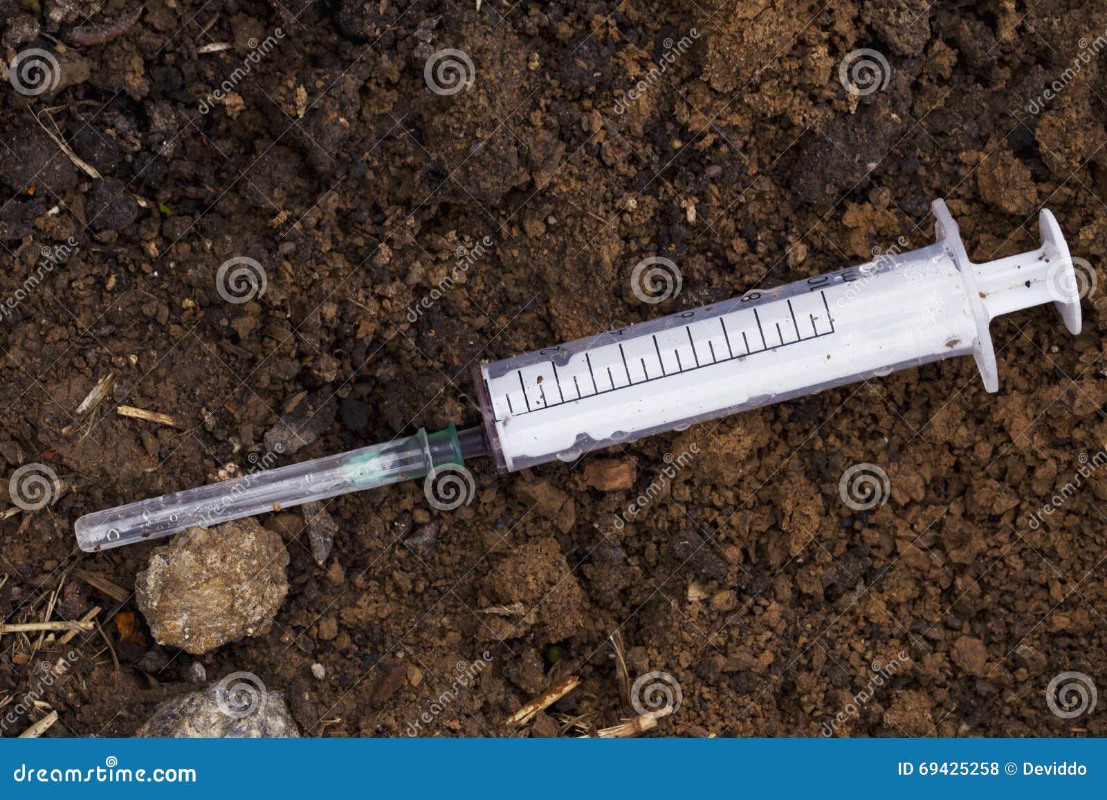 The used syringe stock photo. Image of crime, soil, used 69425258