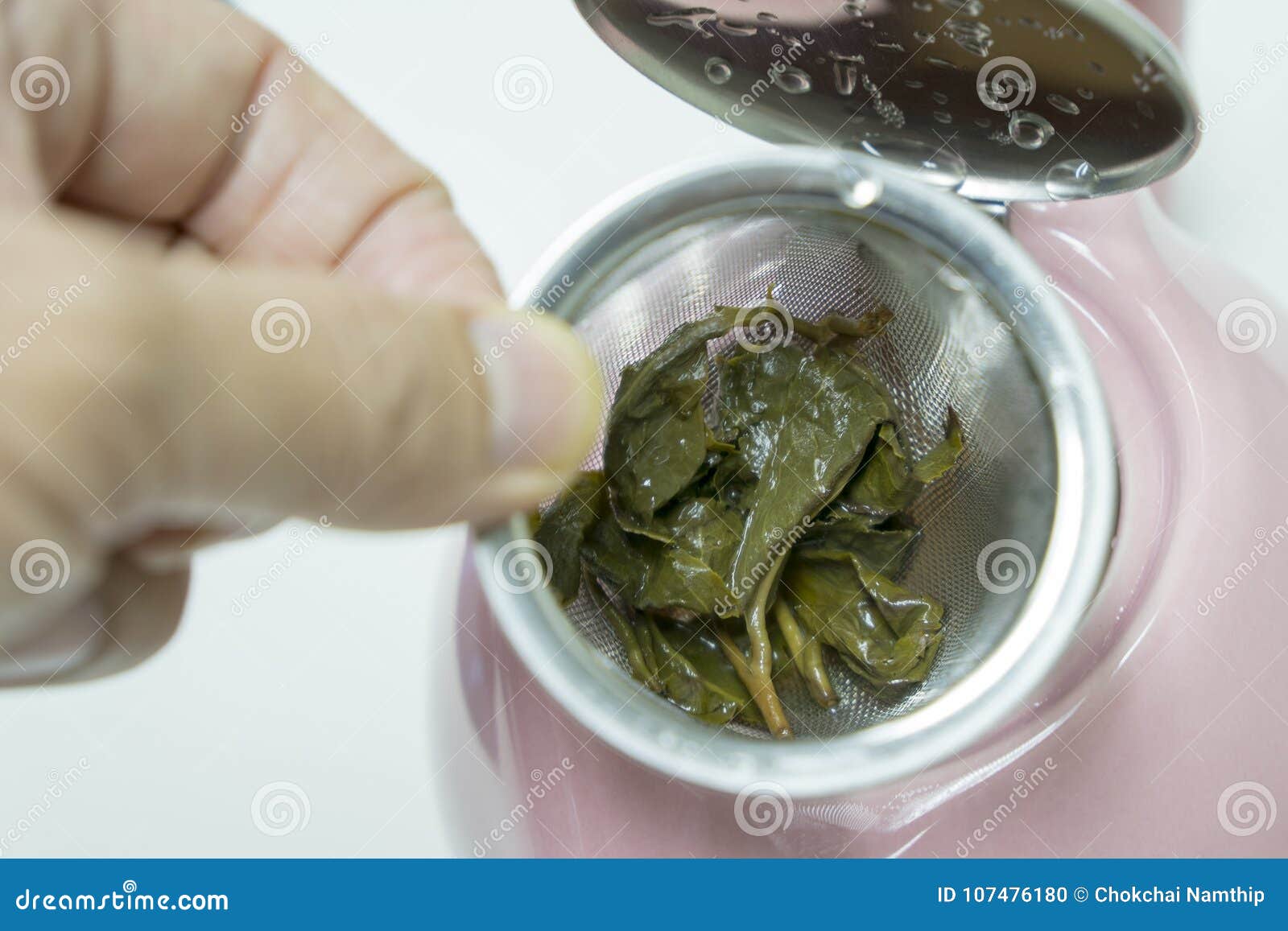 Used Tea Leaves in the Kettle and Hands. Stock Photo Image of kettle, colander 107476180