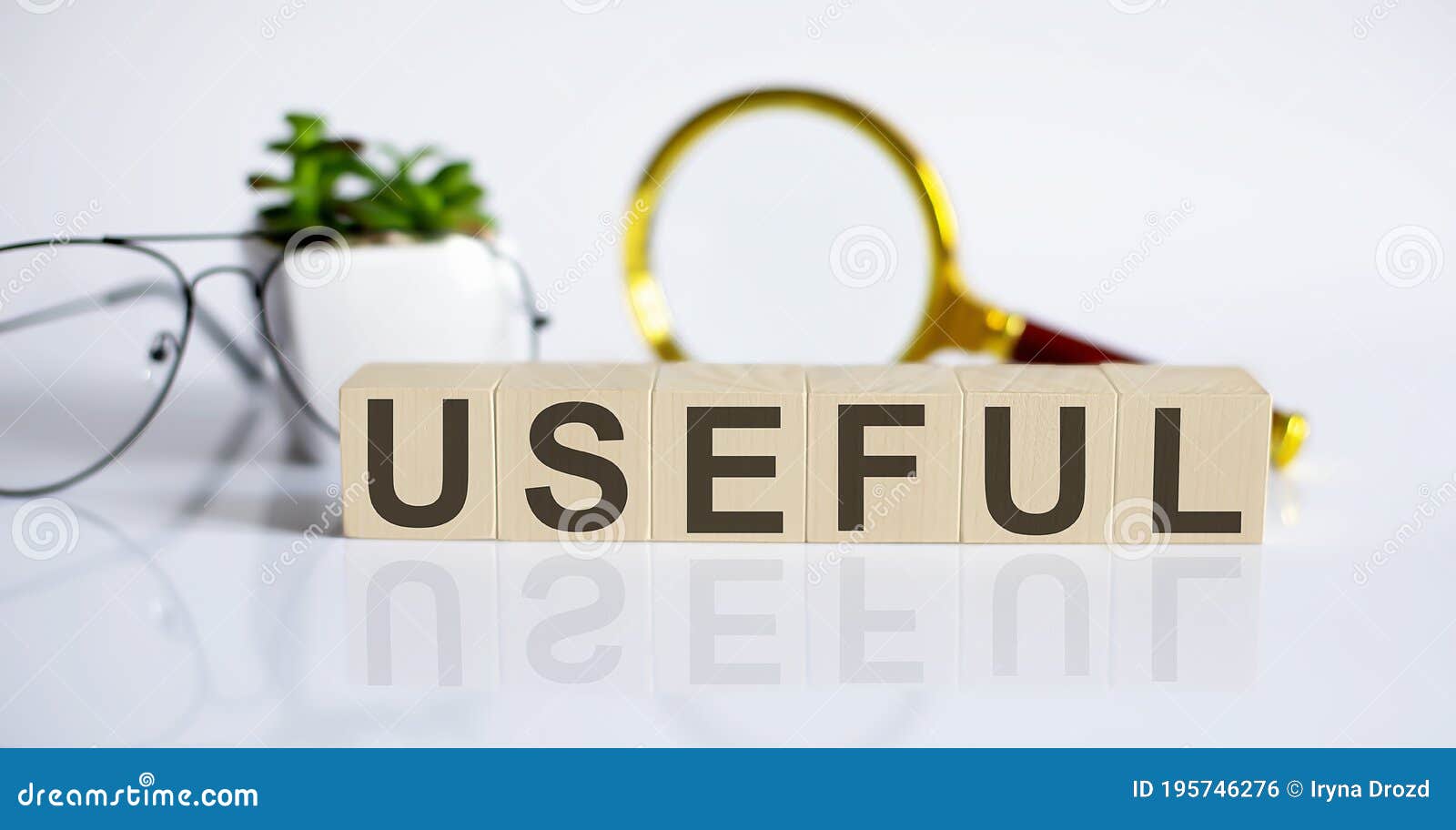 USEFUL Word Written on Wood Block with Glasses and Magnifier Business USEFUL Word Written on Wood Block with Glasses and Magnifier Business