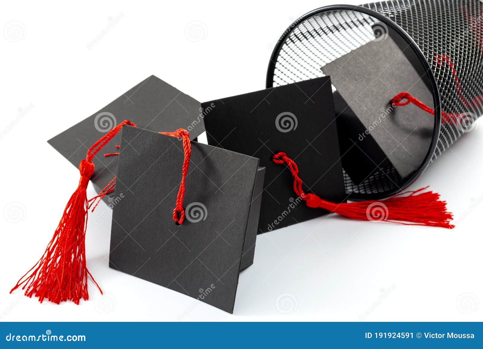 useless university degree and collage is a waste of time and money concept theme with numerous graduation caps falling out of a